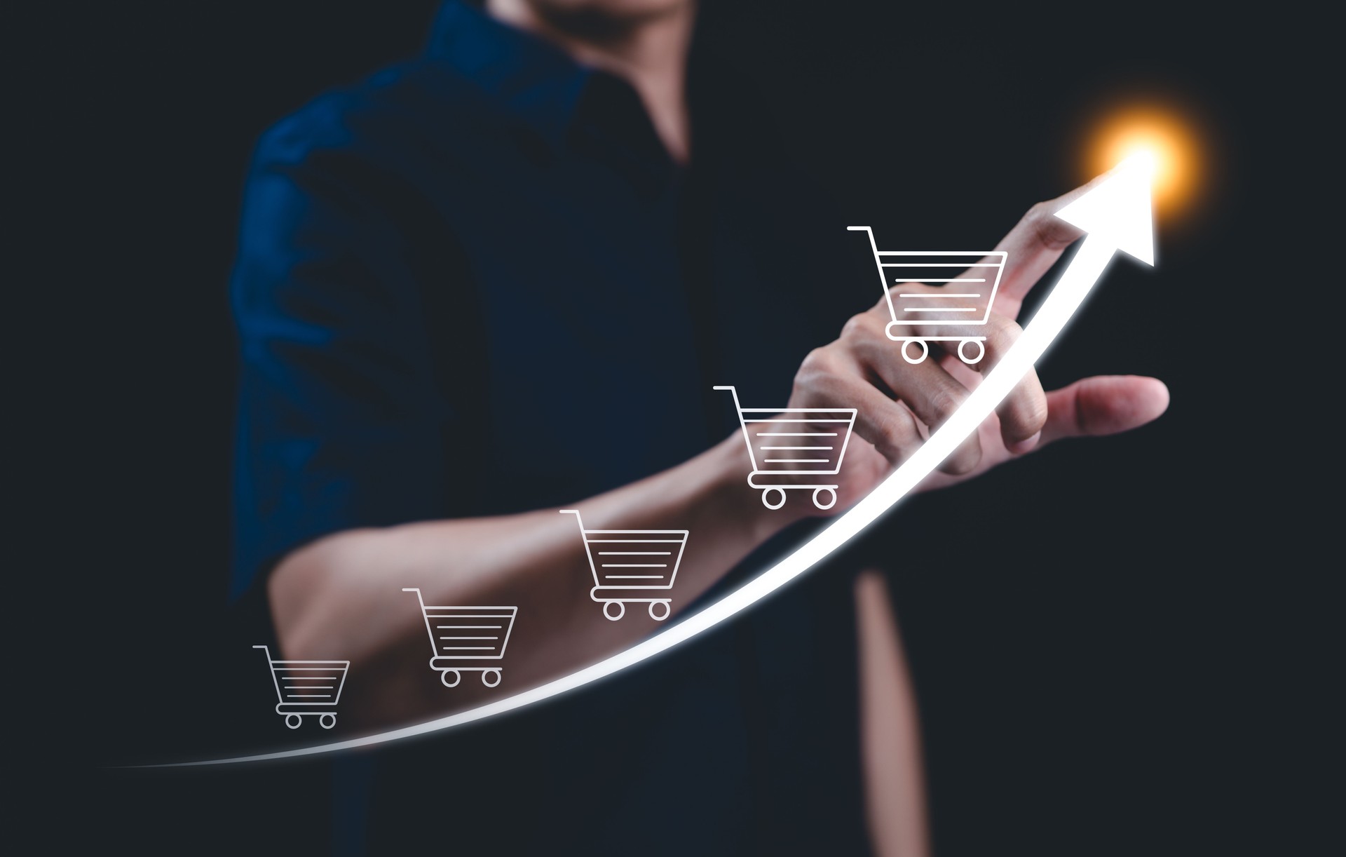 E-commerce concept. Online sale business growth, Businessman drawing increasing trend graph of sale volume with bigger shopping trolley cart. Investment growth goal, Digital Marketing Strategies,